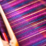 Weaving in-progress using hand-dyed yarns