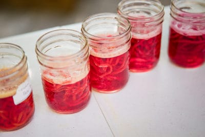 Canning jars with hand-dyed yarn