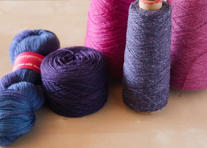 Yarn in a variety of formats — skeins, cakes, balls, cones