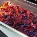 Handpainting with Fustic, Logwood, and Cochineal on sock blanks. This is before heat setting in the oven.