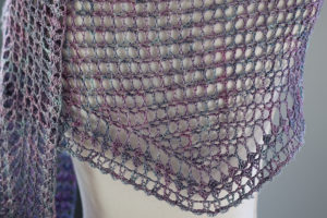 a purple crochet shawl in SweetGeorgia SeaSilk laceweight yarn